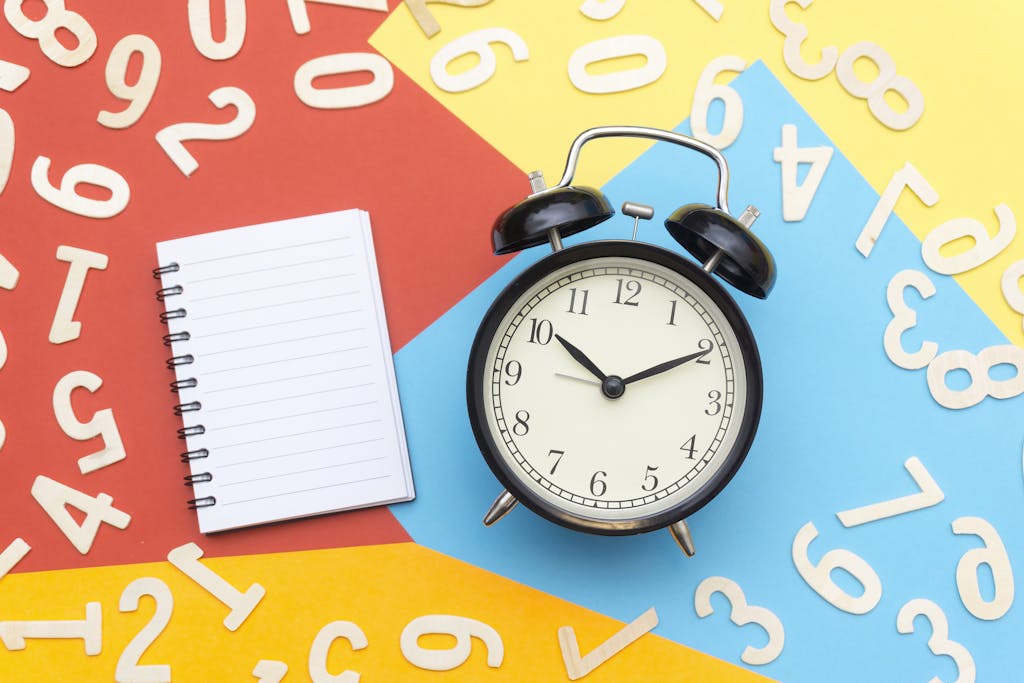 Alarm Clock Lying on Multicolored Surface